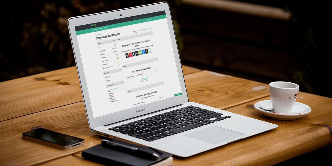 Computer on table in a cafe with hover loaded in the browser